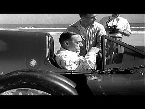 Sir Malcolm Campbell sets a speed record in his Bluebird car at Daytona Beach, Fl...HD Stock Footage