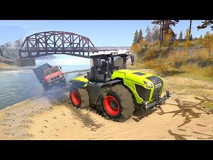 CLAAS XERION 5000 Pulls a Fallen Truck into the Water