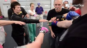 WATCH: Parkinson's patients battle their disease in a very literal way through the Rock Steady Boxing program at CrossFit 309 in Peoria Heights. (Journal Star video by Fred Zwicky) More on this story: http://buff.ly/1ScvKwC | Journal Star