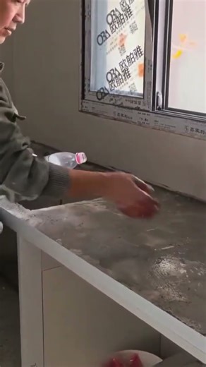 a kitchen table made from building materials being made by a craftsman