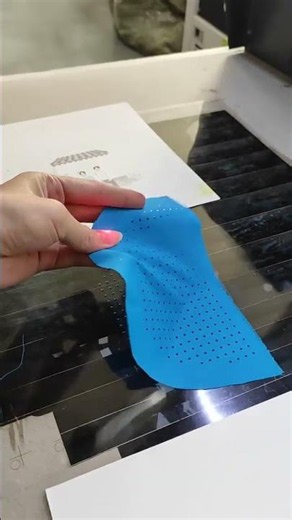 Perforating fabric using a laser marking machine.