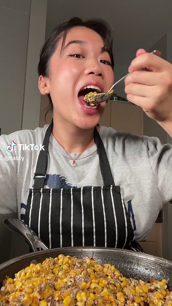 Saigon Street Corn sautéed with bacon and dried shrimp is a flavorful dish that combines the sweetness of corn with the savory richness of crispy bacon and umami-packed dried shrimp. Topped with fresh herbs and cheese, it's a vibrant blend of textures and tastes that captures the essence of the new generation of Vietnamese street food. @groovyfoodiess Ingredients: 2 15-ounce cans corn, drained 1 strip bacon, diced 2 tablespoons dried shrimp 1 scallion, sliced 2 tablespoons grated Parmesan, plus 