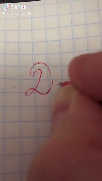 Handwriting Practice with Red Pen on Graph Paper