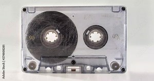 tape winding from beginning to end of clear old retro cassette tape stop motion