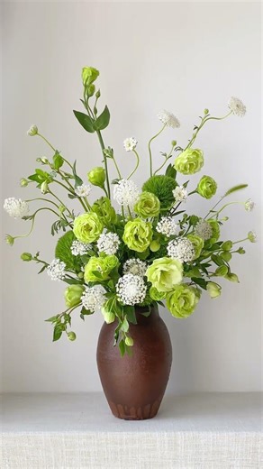 Spring flower arrangement with different shades of green in spring It is touching green. E