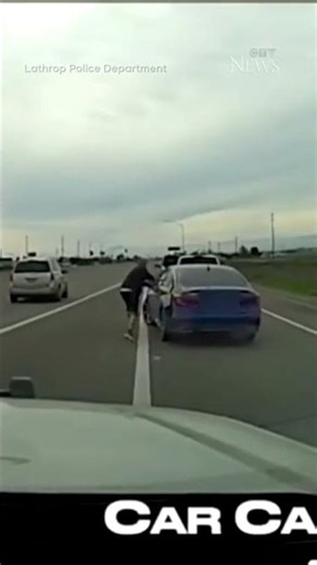 Suspect clings to moving car while fleeing police