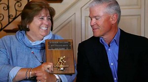 Troy Aikman hands off to TI’s Rich and Mary Templeton after scoring big for United Way