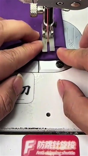 sewing a purple fabric using an industrial sewing machine with precision