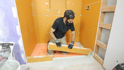 Schluter shower curb installation tips...how to easily customize, install, and waterproof...if you're doing a bathroom remodel and need help with shower waterproofing, check out our step-by-step courses at https://homerepairtutor.com/ #showerremodel #bathroomremodel #bathroomremodeling #bathroommakeover | Home Repair Tutor