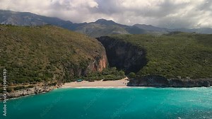 Secluded Gjipe Beach surrounds by mountains , Albania. Aerial push out