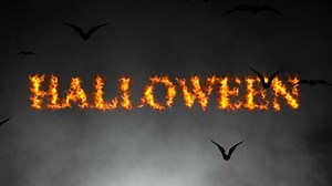 Fiery Halloween text Animation with Spooky Flying Bats and atmospheric smoke. Halloween themed background. 4k