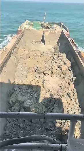 Split Hopper Barge Discharging Dredged Material at Sea