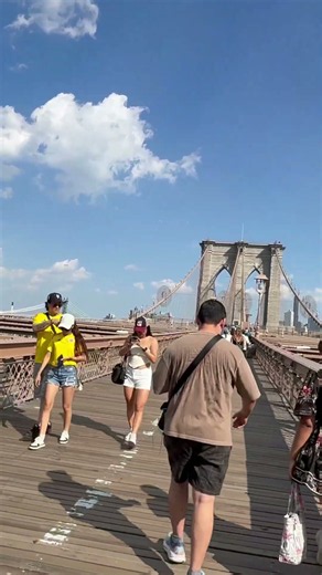 The Brooklyn Bridge: busy, vibrant and full of life, connecting Brooklyn and Manhattan.