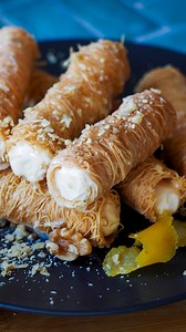KATAIFI ICE CREAM CIGARS. A delicious treat that everyone will enjoy making and eating! Kataifi Pastry is a string Pastry (not a shredded Fillo Pastry) made from a crepe-like batter which is dripped onto a rotating heated metal plate through fine spouts, where it is briefly dried and cooked. You’ll find this and other Kataifi Pastry recipes, along with the full instructional video on the Antoniou Fillo Pastry website, here is the direct link which you can copy into your internet browser: https:/
