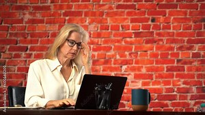 Frustrated upset mature pretty woman cant see computer screen. Put glasses on, adjust, angry at bad eyesight vision, planning budget, review savings and expenses feels tax stress, bills. Copy space Stock Video