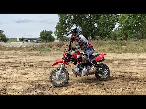 7 and 5 year old riding dirt bikes SSR 70cc