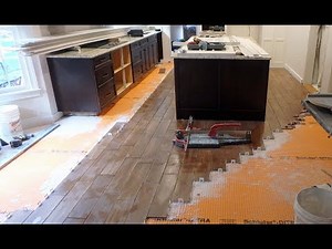 How to install floor tile around a Kitchen Island with wood look plank tile