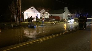 Car crash causes flooded street in west Eugene