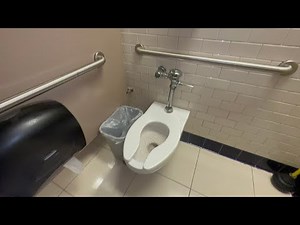 Macy*s men’s restroom featuring a Variety of restroom fixtures.