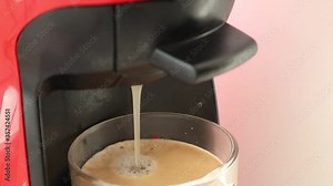 Making Coffee In capsule coffee machine. Process preparation of coffee in the automatic coffee machine.