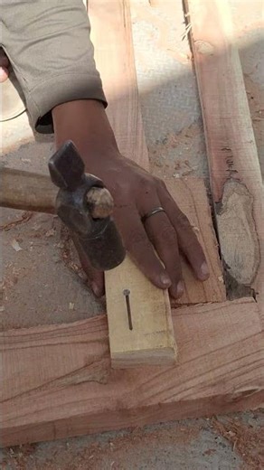 The correct way to hammer a nail into wood.