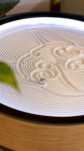 17K views · 309 reactions | ✨ Watch as the Oasis Mini brings a playful pup to life in the sand!  This mesmerizing kinetic art piece uses a tiny ball to carve intricate patterns, creating a relaxing and enchanting experience.  Dive into the calming magic and let your worries drift away. ✨ #KineticArt #OasisMini #SandArt #Relaxation #Mesmerizing #ArtInMotion #CalmingTech | Grounded Labs | Facebook