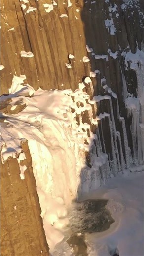 Towering basalt columns and a frozen waterfall #Iceland #BasaltColumns #FrozenWaterfall