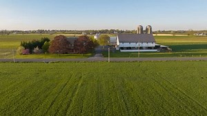 clip-3517465517-golden-hour-sunset-over-classic-american-farm