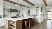 Traditional large L-shaped kitchen with large island and kitchen...