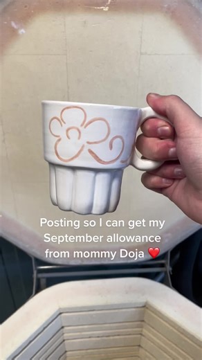 Exploring Floral Ceramic Mug Designs in a Pottery Studio