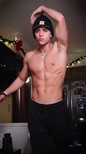 Muscular Male Performance in Festive Indoor Setting