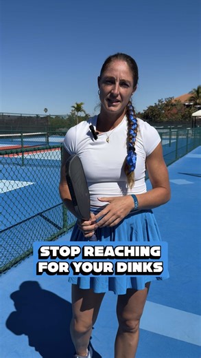 Stop reaching for your dinks. Move your feet instead. 👣 One of the biggest mistakes I see at the kitchen line is players reaching sideways for the ball instead of taking a quick step to get behind it. When you reach: ❌ Your paddle face gets unstable ❌ You lose control ❌ The ball is way more likely to pop up But when you move your feet and get your body behind the ball: ✅ Your contact point is more in front ✅ Your paddle stays steady ✅ Your dinks stay low and controlled The best dinkers aren’t j