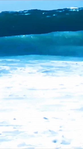 Stunning Ocean Waves Against Clear Blue Sky