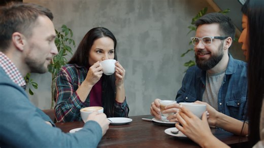 Friends Enjoying Coffee in a Cafe | Premium Stock Video Footage