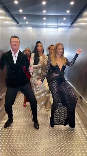 Luke Evans, Olly Murs, Beverley Knight, Nicole Scherzinger and Leean Rimes dance in an elevator.
