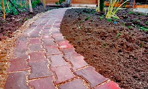 Jardin : poser des pavés autobloquants