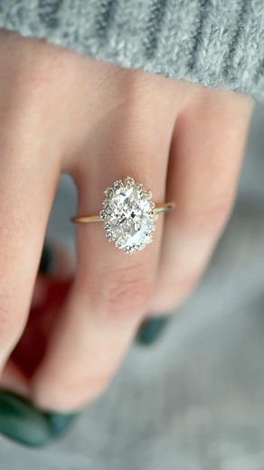 Melanie Casey Fine Jewelry on Instagram: "PETALED HALO 🌼🌸✨ The Sapling Ring is surrounded by a halo of white diamonds that rises and falls like the scalloped edge of a petal. Want to know a design secret? The Sapling Ring halo sits just below the focal stone, creating both depth and movement as well as causing the focal stone to appear larger by comparison. While the Sapling Ring with an oval cut is not currently in the permanent collection, we’d love to help you create your own custom version