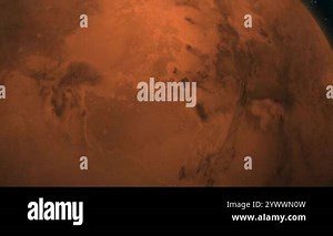 Detailed view of Mars in space. Close-up image of the Martian surface, showcasing its rusty-orange terrain and craters against a backdrop of a dark night sky sprinkled with stars Stock Video Footage - Alamy