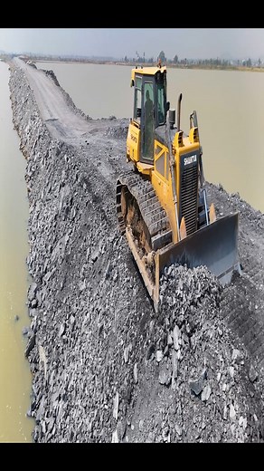 187K views · 1.6K reactions | Episode 24!Fantastic road construction project. Use trucks, a wheel loader, and a dozer Shantui to dump rocks into a sizable lake. It is truly amazing to study Project 1, which is a rapid construction of a road across a large river, with a team of experts pouring rocks into a lake, making it the site of a magnificent fish farm. | Lewis Mcinally | Facebook