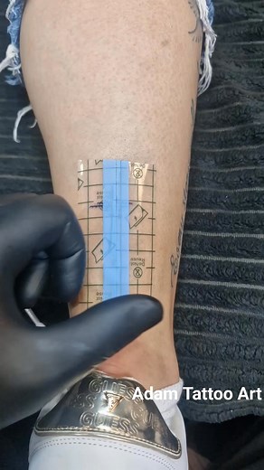 Cross tattoo covered with second skin tattoo protection Adam Tattoo Art | Adam Tattoo Art