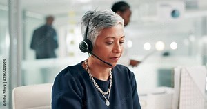 Customer service, phone call and mature woman with headset, conversation and help desk management. Client support, telemarketing and virtual assistant at callcenter with lead generation at crm office