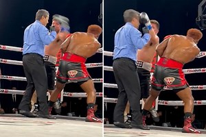 Watch boxer punch referee flush in the face but official takes it like a champ