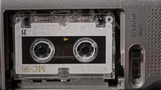 Vintage Audio Tape with a Blank Label Spinning in Cassette Recorder, Close-up | Premium Stock Video Footage