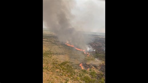 Authorities are set to declare the entire NT a fire danger area until March, as a 'enormous' fire burns east of Tennant Creek.