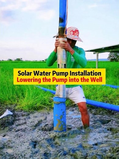 Solar Water Pump Installation Lowering the Pump into the Well