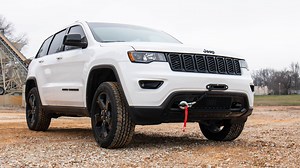 Give your Jeep Grand Cherokee a sleek recovery system that blends in seamlessly with the factory aesthetic with Rough Country’s WK2 Hidden Winch Mounting Kit! This convenient winch mounting kit allows you to upgrade your vehicle with any standard-sized winch, giving you the ability to make it out of any tough spots you may encounter while also adding a more interesting, aggressive look to the front end of your vehicle. Each kit includes a remote port relocation system that moves the terminal fro