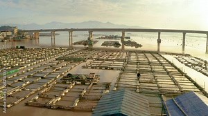 Flying over floating fish farms in China.