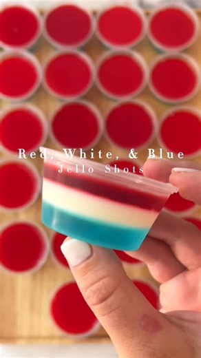 Becca | TeacherTastes on Instagram: "RED, WHITE, & BLUE JELLO SHOTS *you can make it non alcoholic by using water instead of vodka* Perfect for your Fourth of July celebration! Makes 24 Jell-O shots (you can get the plastic containers with lids from Walmart or target) -3 oz pack of blue raspberry jello -3 oz pack of cherry jello -1 packet (.25 oz) of unflavored gelatin (it comes with four just use one) -7 oz sweetened condensed milk -2 1/4 cups of pinnacle whipped vodka -3 1/4 cup water Start wi