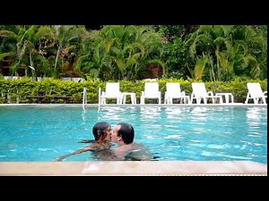 Young couple kissing, swimming and have a fun in the swimming pool. slow motion. 1920x1080