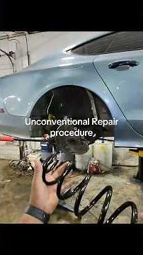 Unconventional repair procedure while replacing an Audi rear coil spring